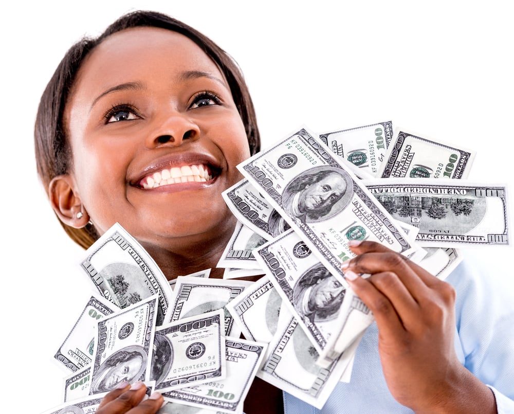 Successful business woman holding dollar bills - isolated over white