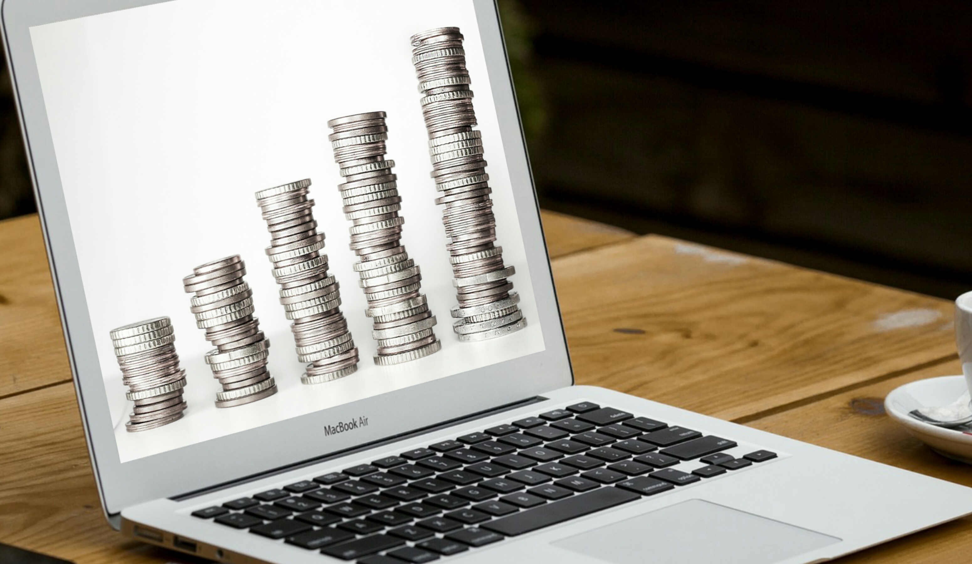 Laptop coins bar chart