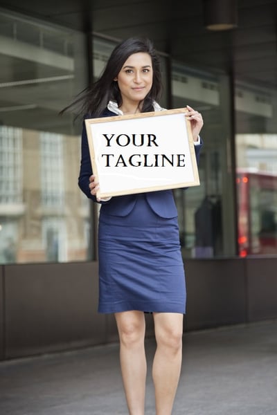 woman_holding_sign_your_tagline.jpg